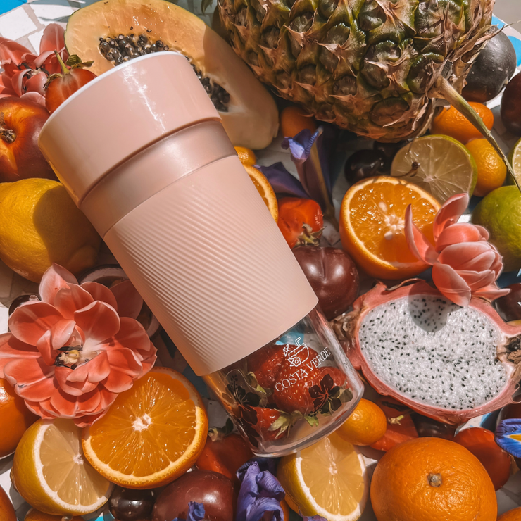 pink blender and fruits